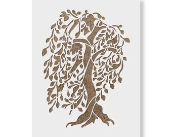 May include: A rectangular stencil featuring a cutout design of a weeping willow tree. The tree has a textured brown trunk and branches with numerous drooping leaves, set against a solid white background with a clean, die-cut border.
