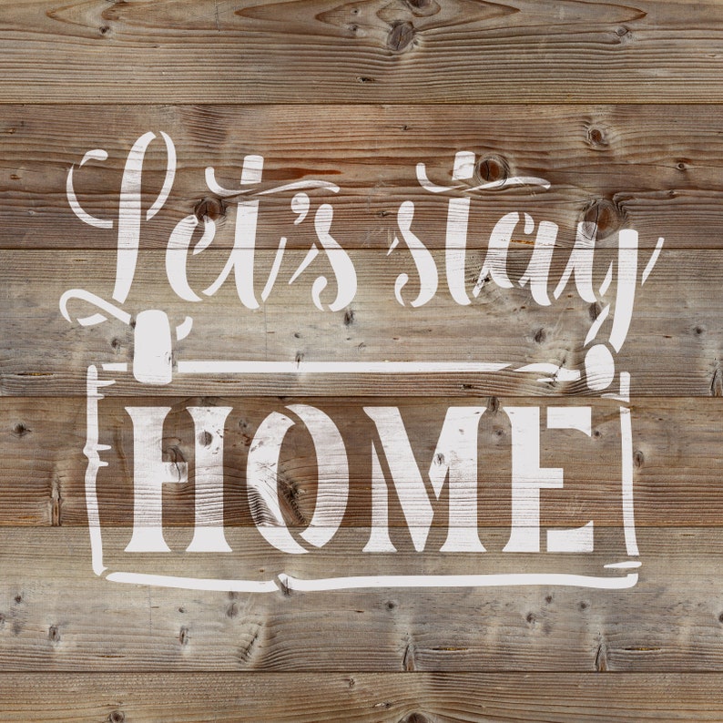 May include: White painted wood sign with the text "Let's stay home" in a decorative font.