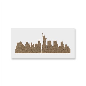 May include: A brown paper stencil of the New York City skyline, including the Statue of Liberty.
