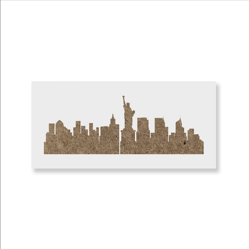 May include: A brown paper stencil of the New York City skyline, including the Statue of Liberty.