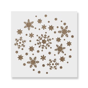K&ouml;nnte beinhalten: Eine wei&szlig;e Schablone mit einem Design aus Schneeflocken und Sternen. Die Schablone ist perfekt, um ein winterliches Design auf W&auml;nden, M&ouml;beln oder anderen Oberfl&auml;chen zu erstellen.