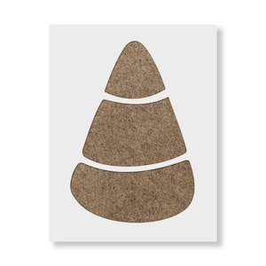 May include: A stencil featuring a candy corn shape with three distinct horizontal sections. The design is cut out from a rectangular sheet, showing the brown, textured material of the stencil through the negative space of the candy corn form.