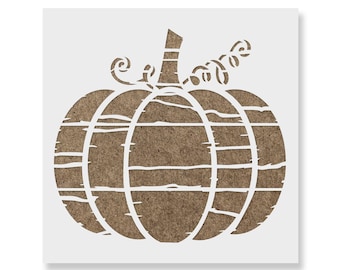 May include: A square stencil featuring a cutout design of a pumpkin with a stem and a curly vine. The pumpkin shape is divided into vertical segments by white lines, with horizontal distressed white lines across the brown textured surface.