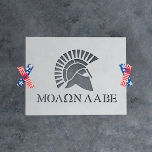 May include: A white stencil with a Spartan helmet and the Greek phrase "ΜΟΛΩΝ ΛΑΒΕ" (Molon Labe) meaning "Come and get them".