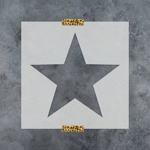 May include: A white stencil with a large, gray star shape in the center. The stencil is framed by a leopard print tape border.
