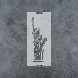 May include: A white stencil of the Statue of Liberty, a famous landmark in New York City. The stencil is on a gray background.
