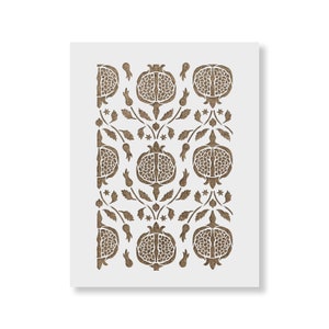 May include: A brown stencil with a repeating pattern of pomegranates and leaves. The stencil is designed for use with paint or other mediums to create a decorative design.