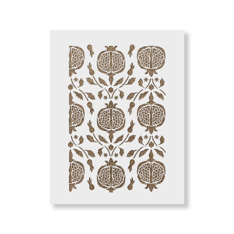 May include: A brown stencil with a repeating pattern of pomegranates and leaves. The stencil is designed for use with paint or other mediums to create a decorative design.