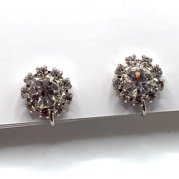 Vintage silver tone rhodium plated round clear rhinestone halo flower screw back earrings