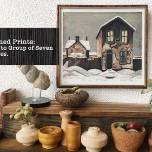 May include: Signed prints of a winter scene with a house and snow. The prints are part of the "Ode to Group of Seven Series".