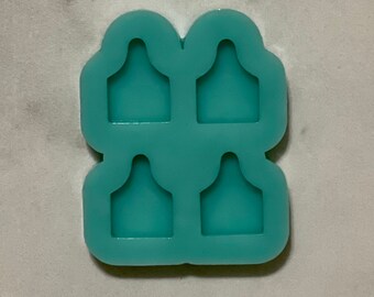 May include: A teal silicone mould with four rectangular cavities, each shaped like a small, rounded, upside-down triangle.