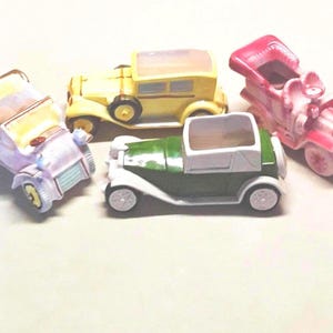 Four Mid Century Ceramic Classic Car Planters, Including Relpo, Lipper & Mann, and Inarco