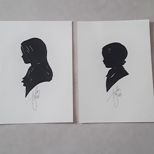 Zwei 1999 signierte Tim Arnold (of Tennessee) Hand-cut Portrait Silhouetten, Mädchen und Junge