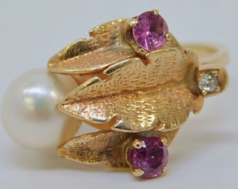 Circa 1960s 14k Yellow Gold, White Cultured Pearl, Ruby, and Diamond Flowering Plant Design Ring, With Textured Finish on Leaves