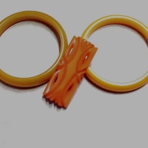 Early or Mid 20th Century Tested Bakelite, Carved and Pierced Brooch (Tangerine) & 2 Bangle Bracelets (Pea Green, Butterscotch)