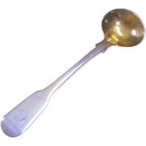 May include: A silver-coloured ladle with a round, gold-coloured bowl and a long, slender handle. The handle has a flattened end with a small, circular design. The ladle is likely made of metal and is designed for serving.