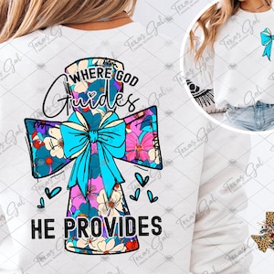 Puede incluir: Camiseta blanca de manga larga con un diseño de cruz floral y el texto "Where God Guides He Provides".