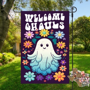 May include: A purple welcome sign with the text "Welcome Ghouls" in a retro font. A white ghost with a blue gradient and a happy face is surrounded by colorful flowers.