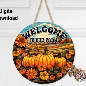 May include: Round wooden sign with a blue sky, sunflowers, pumpkins, and the text "Welcome to our patch".