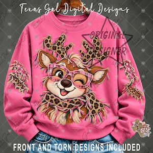 May include: A bright pink long-sleeve sweatshirt featuring a central graphic of a brown reindeer wearing pink plaid glasses and a leopard print scarf. The sleeves have distressed patches with leopard print and pink plaid fabric accents.