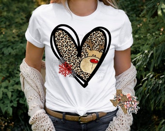 May include: White t-shirt with a black heart-shaped design featuring a leopard print and a cartoon reindeer with a red nose. The heart is surrounded by snowflakes.