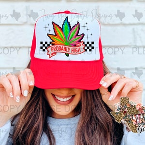 Puede incluir: Gorra de camionero roja con malla blanca en la parte posterior. La parte delantera de la gorra presenta una hoja de marihuana colorida con el texto "Probably High" en una pancarta blanca.