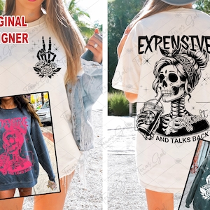 May include: Cream-colored t-shirt with a black graphic of a skeleton hand making a peace sign with roses. The back of the shirt features a skeleton drinking from a cup, with the text "EXPENSIVE, DIFFICULT, AND TALKS BACK."