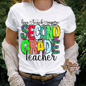 May include: White t-shirt with a colorful graphic that says "love teach inspire SECOND GRADE Teacher".