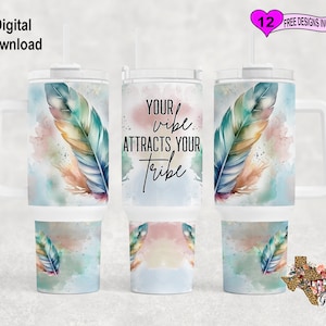 May include: A white tumbler with a handle and a straw. The tumbler has a watercolor design of feathers and the text "Your vibe attracts your tribe".