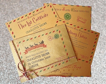 May include: A set of four brown paper envelopes with red and white trim. The envelopes are addressed to Charlotte Brown and include a "Nice List Certificate", "Delivery Notice", and "Reindeer Express" label. The envelopes are tied together with twine.