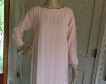 Vintage 1960's Pink Longe sleeve Dress with a 14 inch Beaded trim on the bottom of Dress