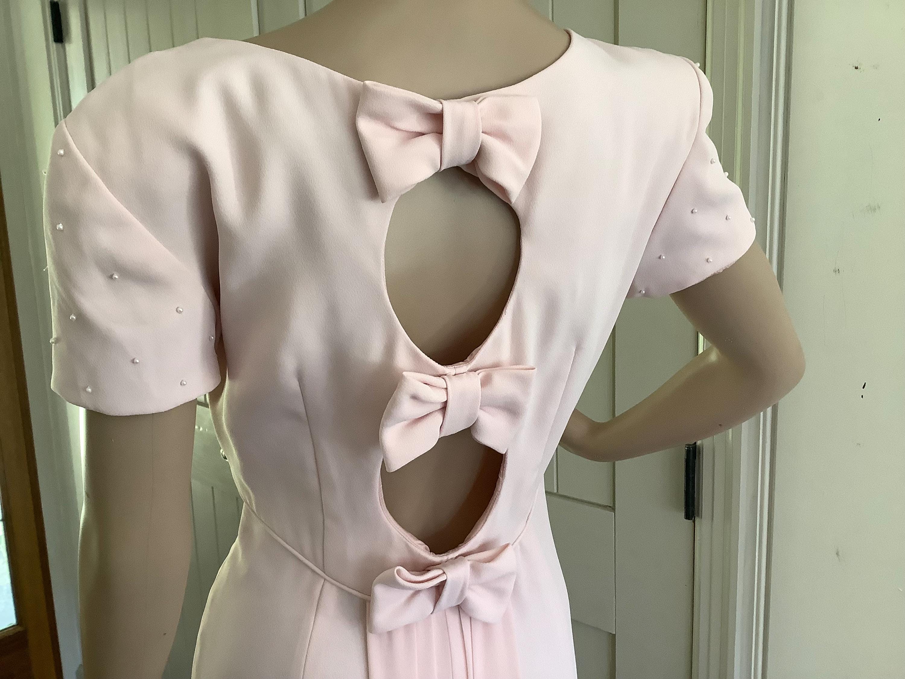 boohoo pink bow dress Boohoo Bow Back Mini Skater Dress, $39 | Asos