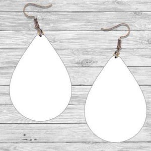May include: A pair of teardrop-shaped earrings featuring a solid white surface and metallic bronze-toned fishhook ear wires. The earrings have a smooth, flat finish and a simple, symmetrical design, suspended by curved metal hooks for attachment.