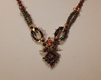 Collar intrincado de cuentas marrones y doradas con cierre de langosta y cadena de extensión