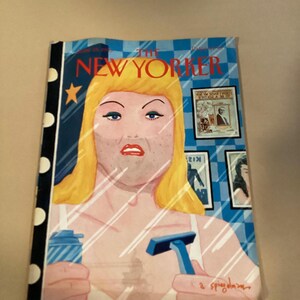 May include: The New Yorker magazine cover features a woman with blonde hair looking in a mirror, holding a razor and a can of shaving cream. The background is a blue and white checkered pattern. The text "The New Yorker" is printed in black at the top of the cover.