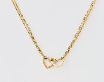 Double heart necklace. Two interlocking hearts. Double star necklace. Interlocking stars. Silver gold stainless steel.