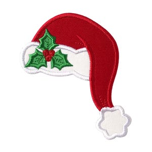 May include: A red and white embroidered Santa hat patch featuring a green holly leaf and red berry design on the white brim. The patch has a white pom-pom at the tip and a white border, showcasing detailed stitching throughout the entire piece.