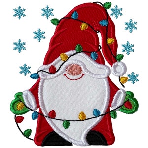 May include: A red and white Christmas gnome with a white beard and a red hat is holding a string of colorful lights. The gnome is surrounded by blue snowflakes.