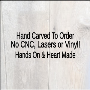 this is a details photo that says, Hand Carved To order. No CNC, Lasers or Vinyl. Hands on & Heart made displayed on a weathered gray barn wood backdrop