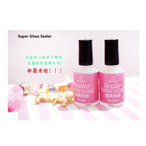 May include: Two clear bottles of super gloss sealer, each with a black cap and a white label that reads "Sealer Super Gloss 超亮光油 Net:15ml".