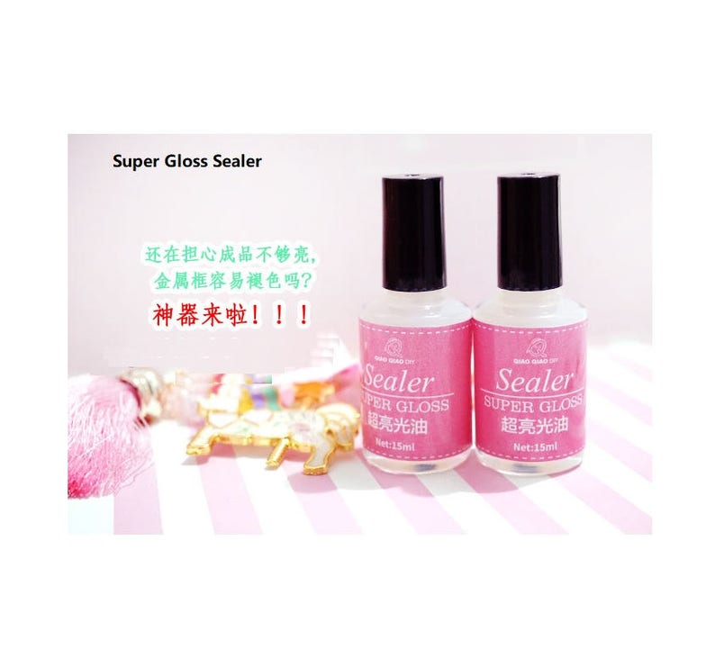 May include: Two clear bottles of super gloss sealer, each with a black cap and a white label that reads "Sealer Super Gloss 超亮光油 Net:15ml".