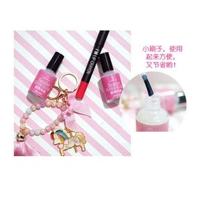 May include: Two clear bottles of nail polish with a pink and white striped background. The bottles are labeled "Sealer Super Gloss" and have a small brush applicator. A pink lip crayon is also visible in the image.