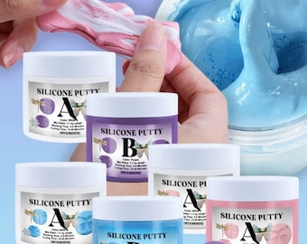 May include: Five containers of silicone putty for crafting. The containers are labeled "Silicone Putty" with the letters "A" and "B" and the colors white, purple, blue, and pink. The containers are on a blue background with a snowflake and a flower mold.