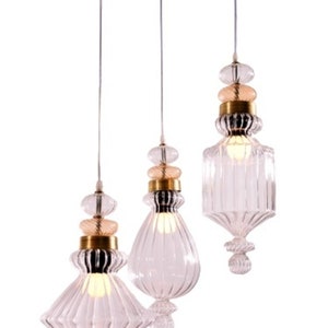 Custom Lighting ,chandelier Lighting, Custom Chandelier includes set of 3 clear pendant Pyrex Glass With a  brass base