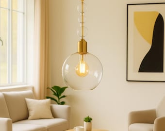 Lampa wisząca w kształcie dmuchanej kuli ze szkła: mosiężne okucia, nowoczesny minimalizm
