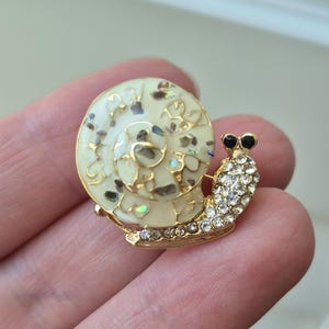 Tiny Snail Brooch, Black Crystal Eyes & Sparkling Shell, Gold Animal Pin for Jackets or Scarves, Miniature Lapel Pin – Neutral color jewelry