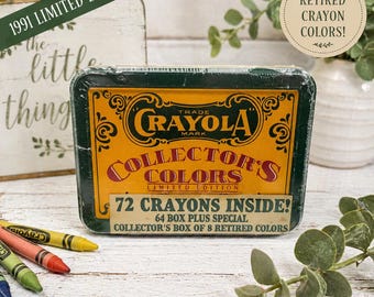 May include: A vintage Crayola Collector's Colors box set from 1991, featuring 72 crayons, including retired colors. The box is dark green with a yellow and red label. The text on the box reads "Collector's Colors" and "Limited Edition."