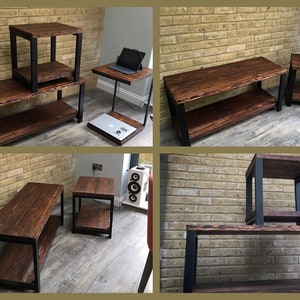 May include: A collection of rustic wooden furniture with black metal frames. The set includes a coffee table, side tables, and a laptop stand. The wood has a rich, dark brown stain, and the pieces are arranged against a brick wall.