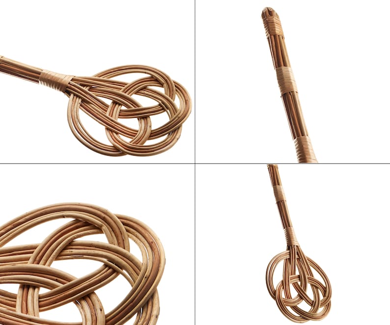 May include: A brown wicker broom with a knotted handle. The broom is made of natural materials and has a rustic look.