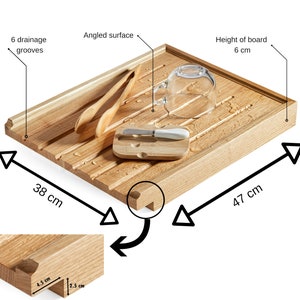 May include: A rectangular wooden serving board, 18.5 inches long and 15 inches wide, with six drainage grooves. It features an angled surface and a 2.4-inch high edge. Includes a small butter knife and a glass.